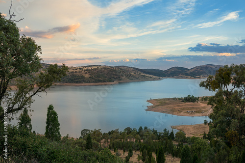 Beautiful nature landscape with lake and mountain hills on sunset