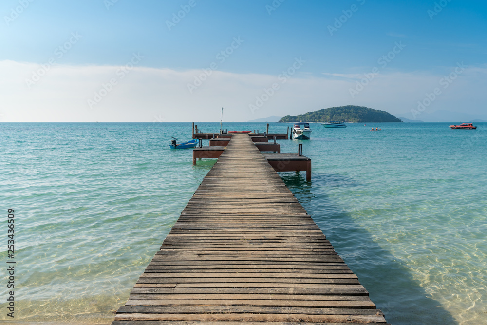 Wooden pier with boat in Phuket, Thailand. Summer, Travel, Vacation and Holiday concept.