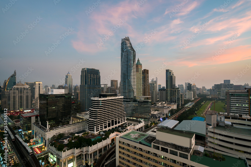 Fototapeta premium Modern building in Bangkok business district at Bangkok city with skyline before sunset, Thailand.