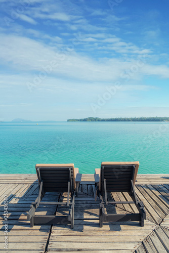 Perfect summer tropical paradise beach with lounge chairs at resort in Phuket  Thailand. Vacation summer holidays and travel concept.