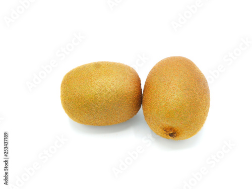 Two whole fresh kiwi fruit isolated on white background. Closeup. - Image