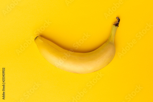 Banana on yellow background.
