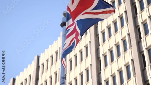 British flag flies violently in high wind close up