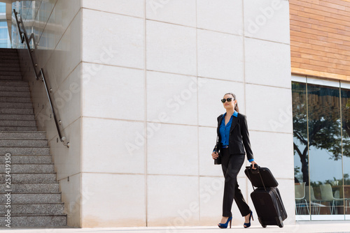 Businesswoman with suitcase