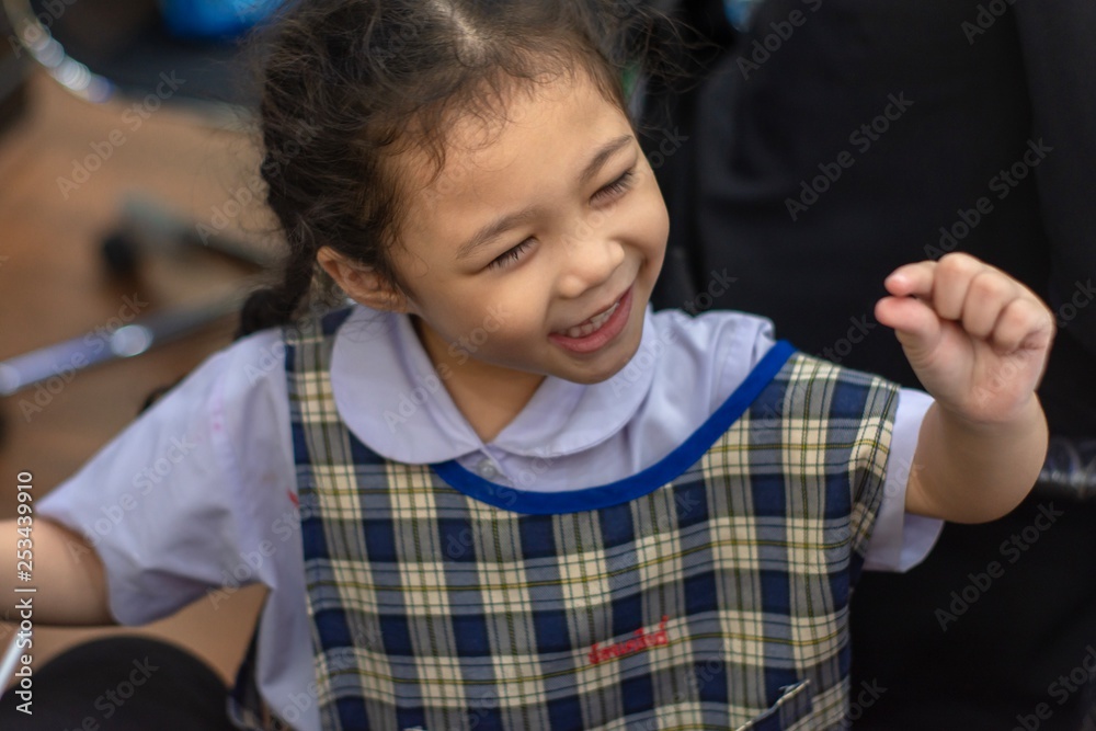 Asian kid girl looking smile posting enjoy on blurred background Asian kid girl looking smile posting enjoy on blurred background