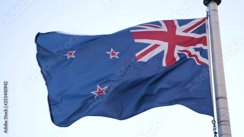 New Zealand flag flies in wind close up