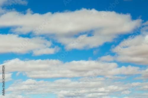 Blue sky background with clouds .
