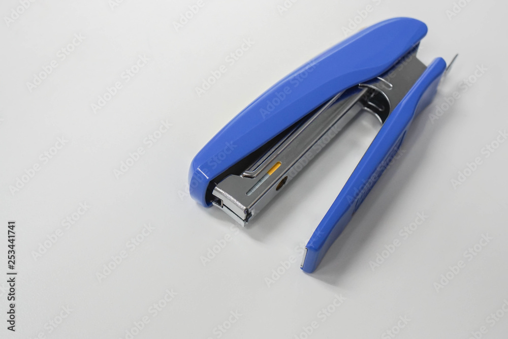 isolated top view office stationary of big blue stapler isolated top view office stationary of big blue stapler