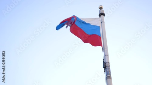Russian flag flies in wind close up in slow motion