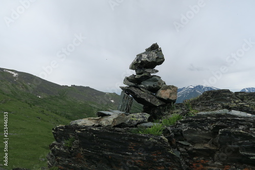 Mountain pile of stones cairn scenic view. Altai Mountains, Russia © Olga