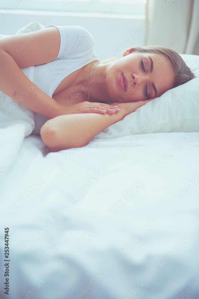 Beautiful young blonde woman sleeping in bed Beautiful young blonde woman sleeping in bed