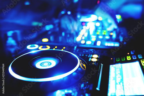  man hand disc jockey mixing and blending music tracks