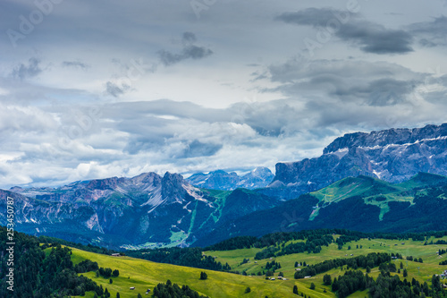 Wallpaper Mural Alpe di Siusi, Seiser Alm with Sassolungo Langkofel Dolomite, a large green field with a mountain in the background Torontodigital.ca