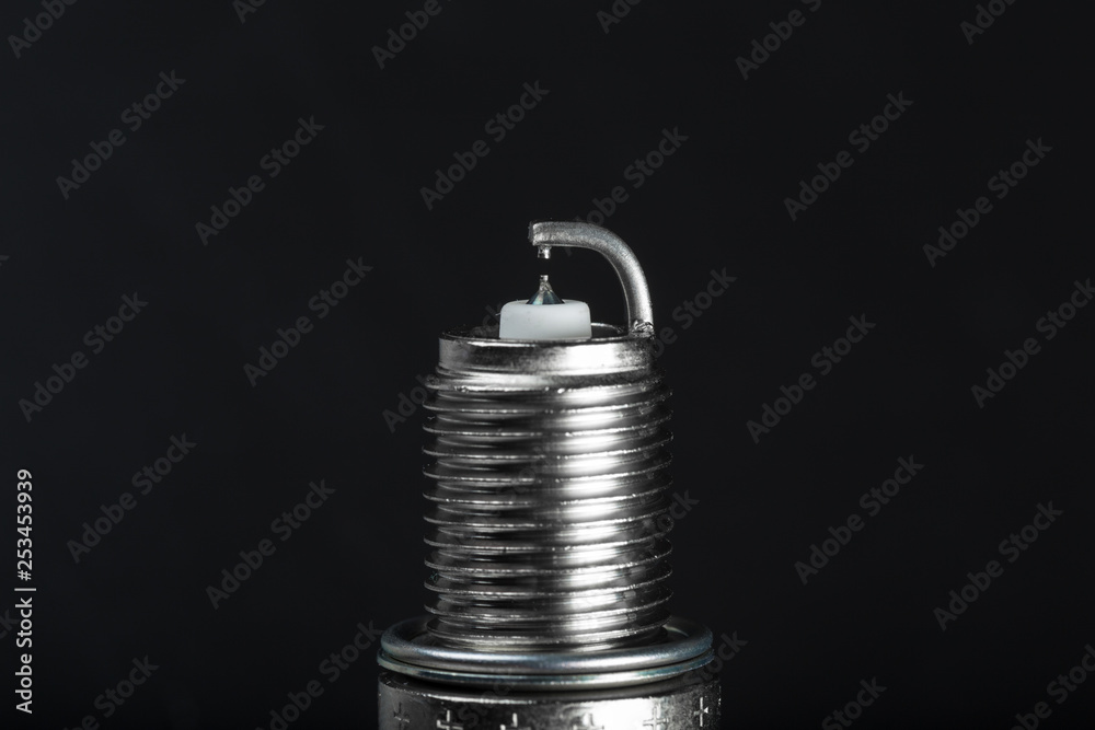 Spark plugs on black background Spark plugs on black background