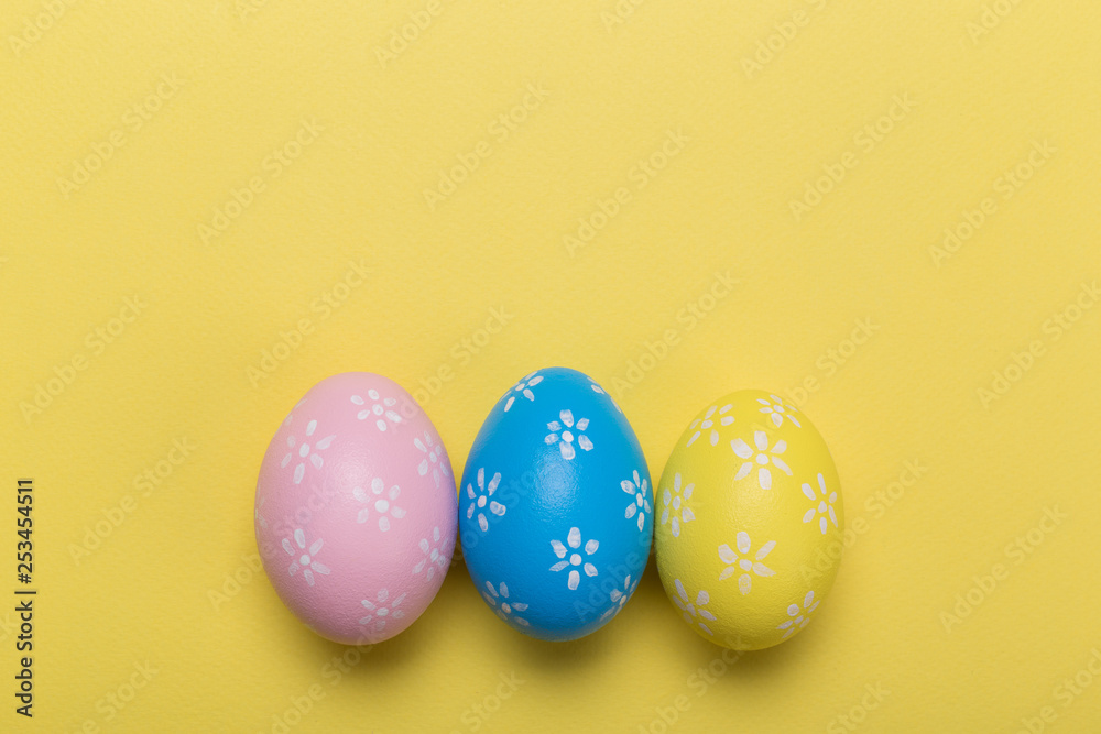 easter eggs on yellow pastel color background with space. Concept easter eggs on yellow pastel color background with space. Concept