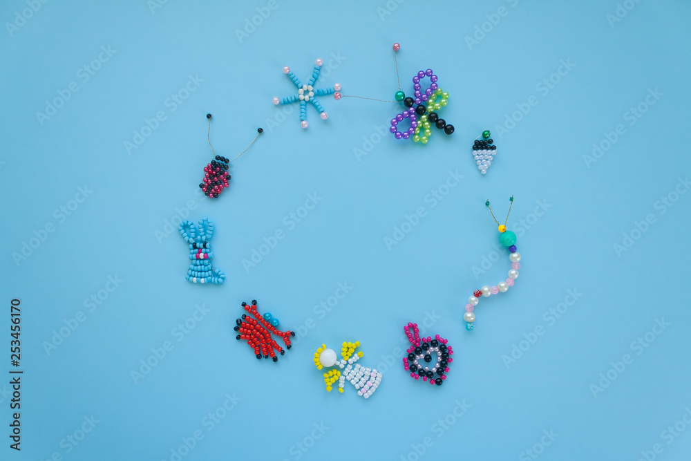 Round frame of children's crafts on a blue background. Round frame of children's crafts on a blue background.