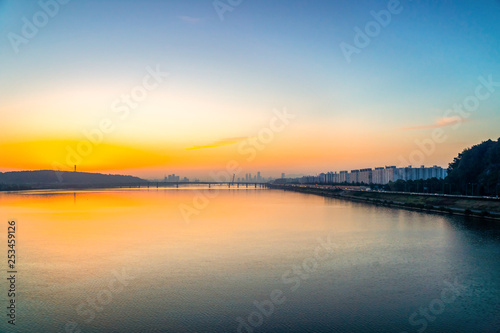 Sunrise at Hun River take picture from Airport Railroad Express (AREX) between Seoul to Incheon Airport , Seoul in South Korea. © somchairakin