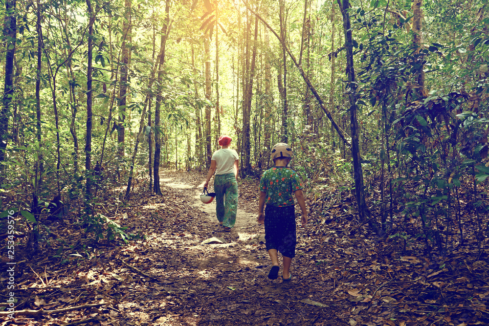 mom and son walking in tropical forest, Phu Quoc mom and son walking in tropical forest, Phu Quoc