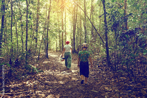 mom and son walking in tropical forest, Phu Quoc