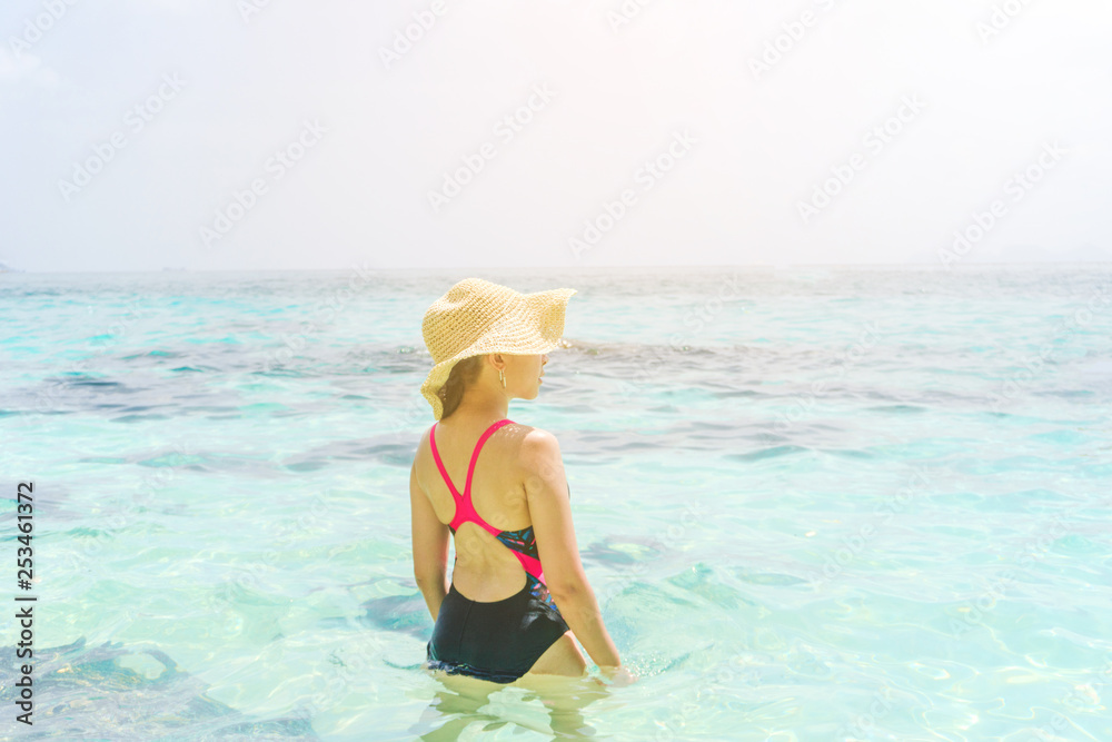 Summer Beach Holiday Woman relax on the beach in free time .
