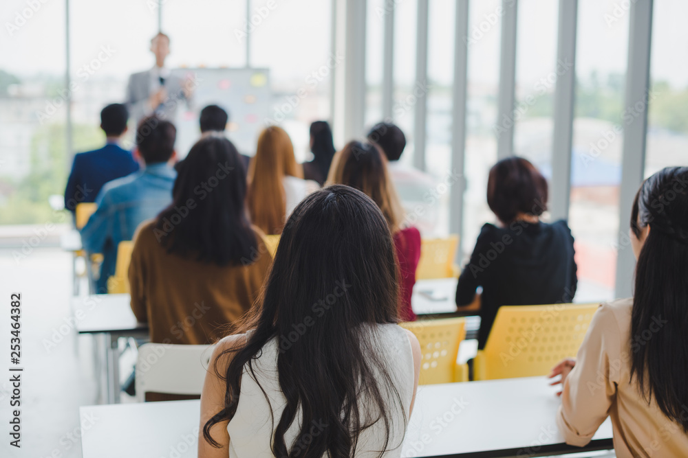 Asian male speaker is speaking at seminars and workshops to the people in the meeting. Asian male speaker is speaking at seminars and workshops to the people in the meeting.