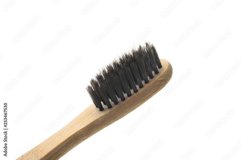 One natural organic reusable bamboo toothbrush isolated on white. Concept zero waste. Clothe-up. One natural organic reusable bamboo toothbrush isolated on white. Concept zero waste. Clothe-up.