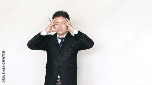 young businessman in depression with hand on forehead