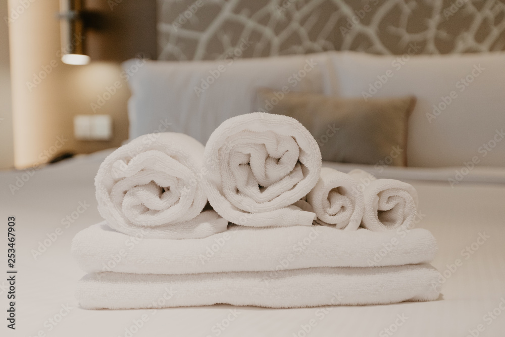white towel decoration on bed in bed room interior white towel decoration on bed in bed room interior