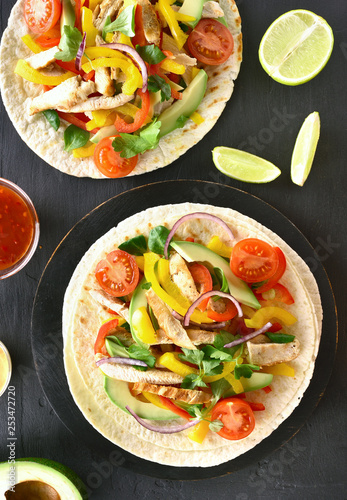 Tacos with chicken meat and vegetables