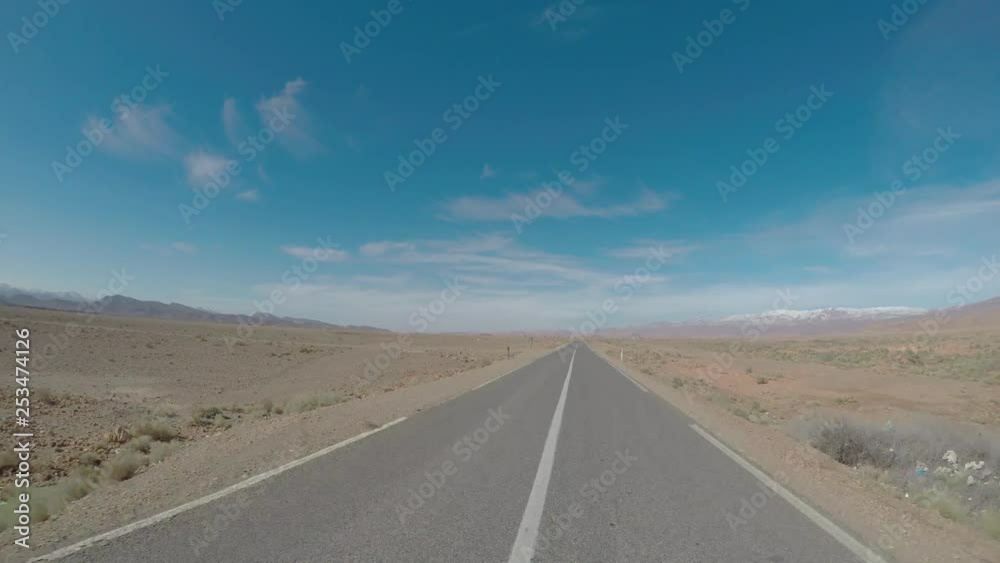 Motion blure POV driving shot on an empty road in northern Africa, Morocco Motion blure POV driving shot on an empty road in northern Africa, Morocco