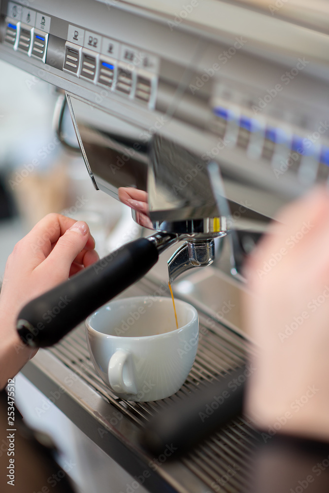 coffee machine in cafe hands