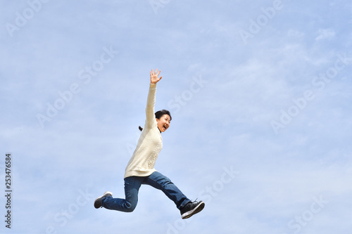 Wallpaper Mural Japanese girl jumping in the blue sky Torontodigital.ca