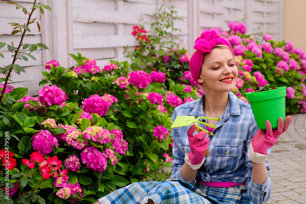 happy woman gardener with flowers. Flower care and watering. soils and fertilizers. Greenhouse flowers. woman care of flowers in garden. hydrangea. Spring and summer. Work for you