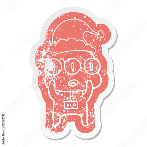cartoon distressed sticker of a three eyed alien wearing santa hat