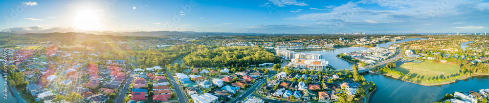 Wide aerial panoramic landscape of luxury houses at Varsity Lakes suburb on Gold Coast, Queensland, Australia