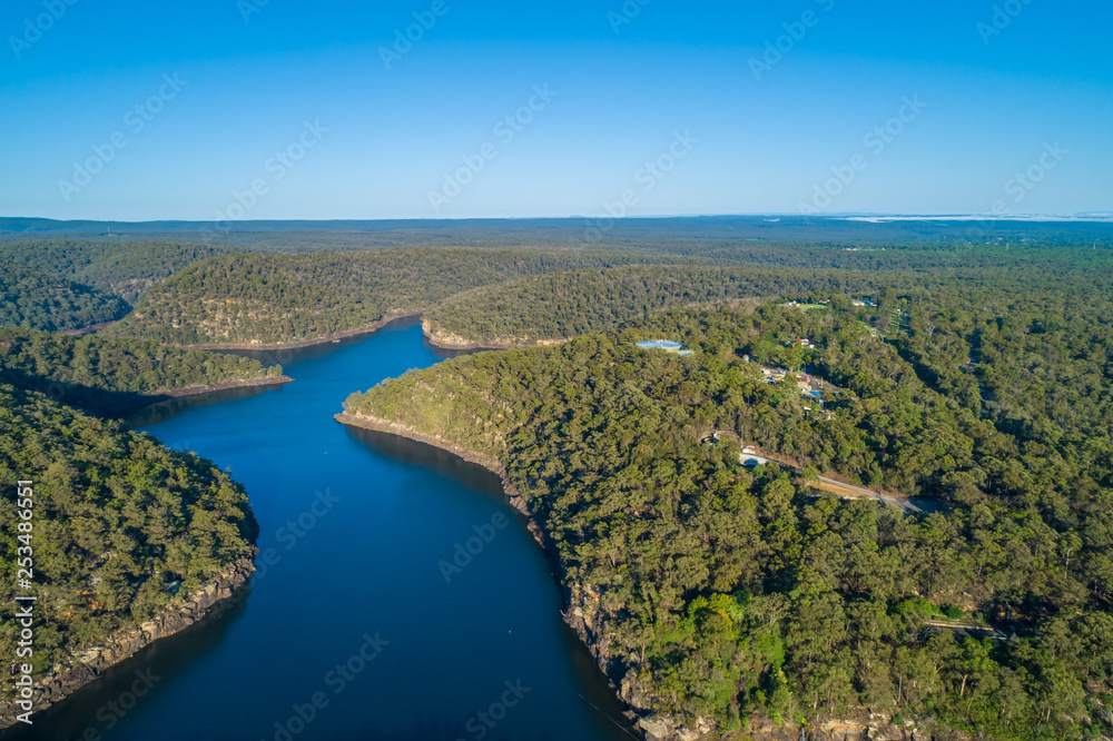 Aerial view of Nepean Lake and forested hills with clear blue sky. Bargo, New South Wales, Australia