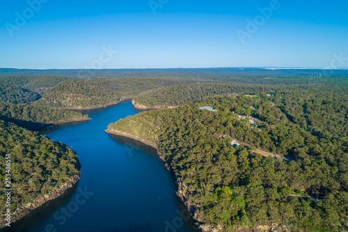 Aerial view of Nepean Lake and forested hills with clear blue sky. Bargo, New South Wales, Australia