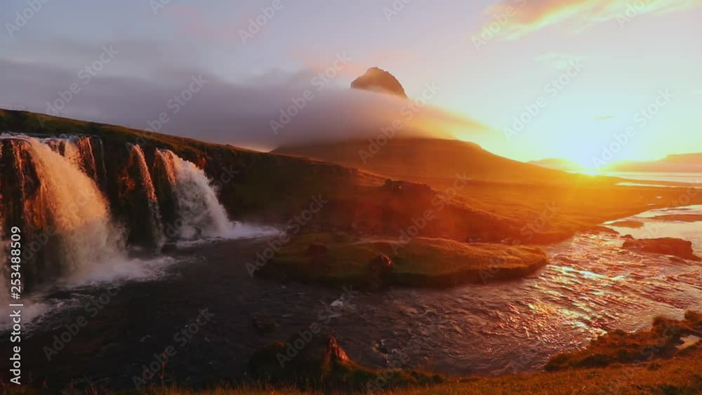 Video shot slow motion of Kirkjufellsfoss waterfall in the morning at Iceland, summertime Video shot slow motion of Kirkjufellsfoss waterfall in the morning at Iceland, summertime