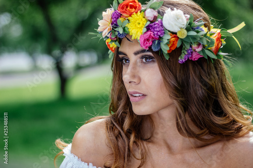 Young woman with flower wreast portrait photo