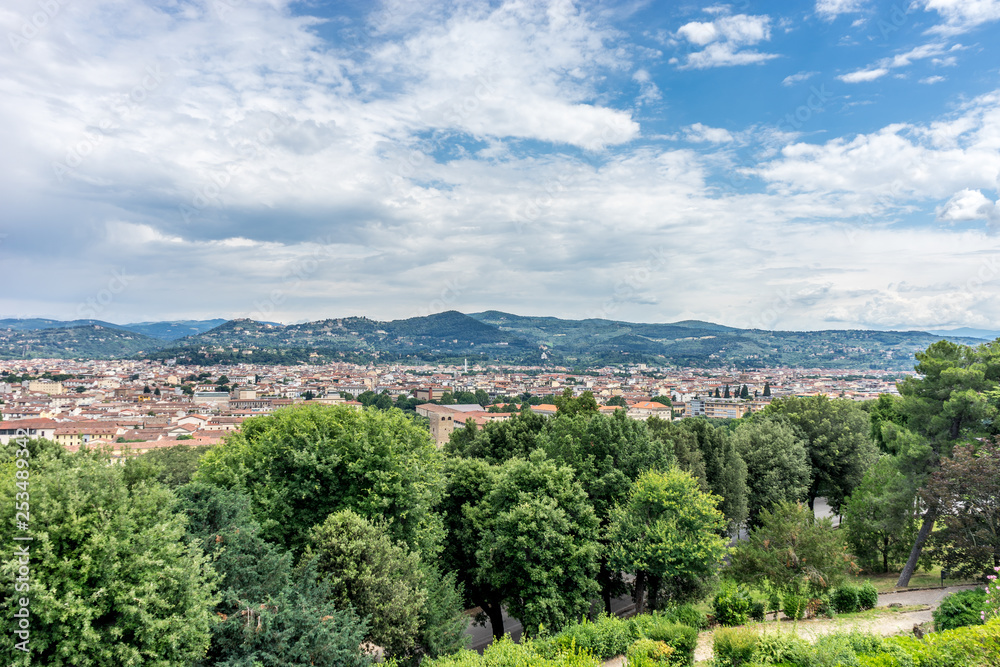 Fototapeta premium Italy,Florence, a large green field with trees in the background