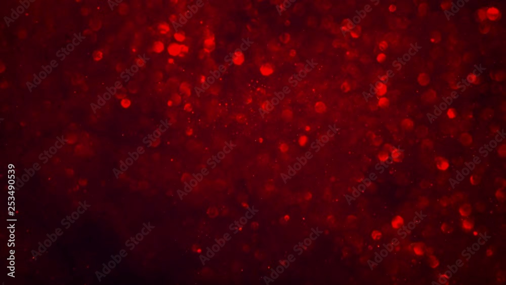 Abstract dark crimson red sparkly particle background with shiny bokeh lights LOOP.