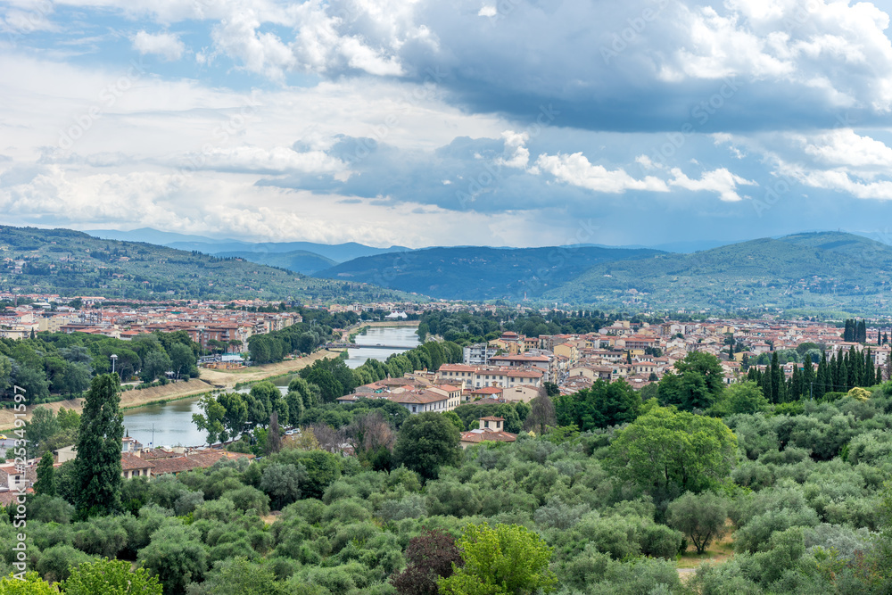 Italy,Florence, a view of a city with a mountain in the background