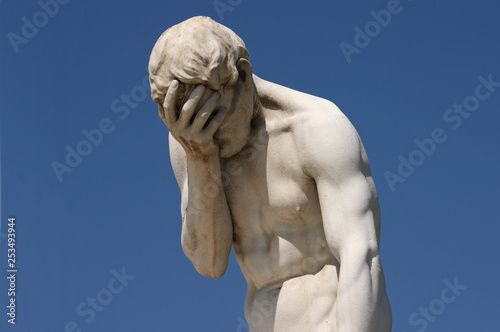 Facepalm statue in Paris - despair, headache, depression photo