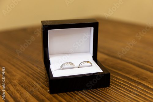 Gold wedding rings on the stand for rings