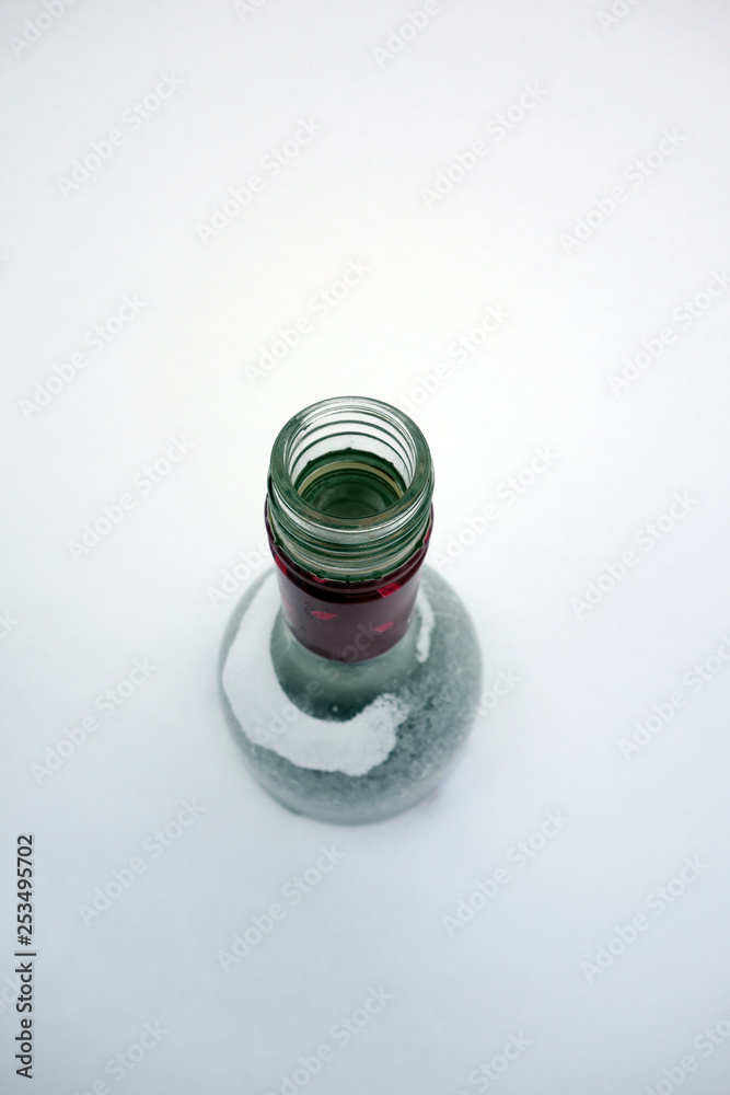 Frozen bottle in the snow