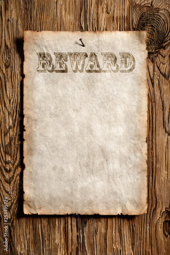old reward advert on wooden wall