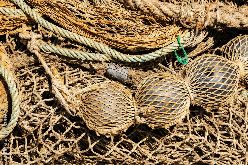 Old fishing nets with ropes and floats - Full frame Stock Photo