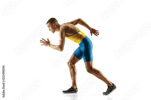 Fototapeta Naklejka Na Ścianę i Meble -  Young caucasian man running isolated on white studio background. One male runner or jogger. Silhouette of jogging athlete with shadows.