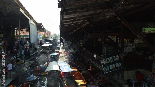 4K Timelapse Local transportation travel at famous tourist attraction Damnoensaduak floating market on March 7, 2019 in Ratchaburi, Thailand. photo