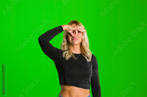 Closeup portrait head shot woman pinches nose with fingers hands looks with disgust something stinks bad smell situation